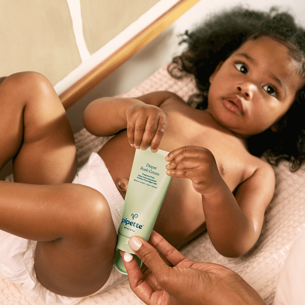 Baby holding Diaper Rash Cream