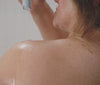 Women applying Pipette Relaxing Body Wash