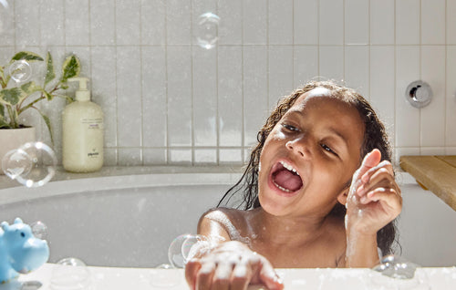 Kid having fun with Bubble Wash Bath.