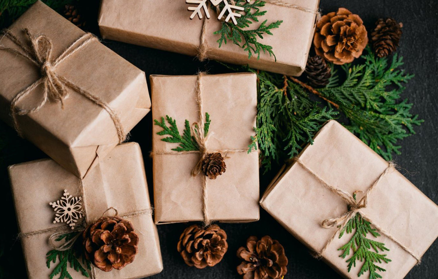 6 Tips to Make the Holidays More Sustainable. Image showcasing recycled craft paper gift wrapping.