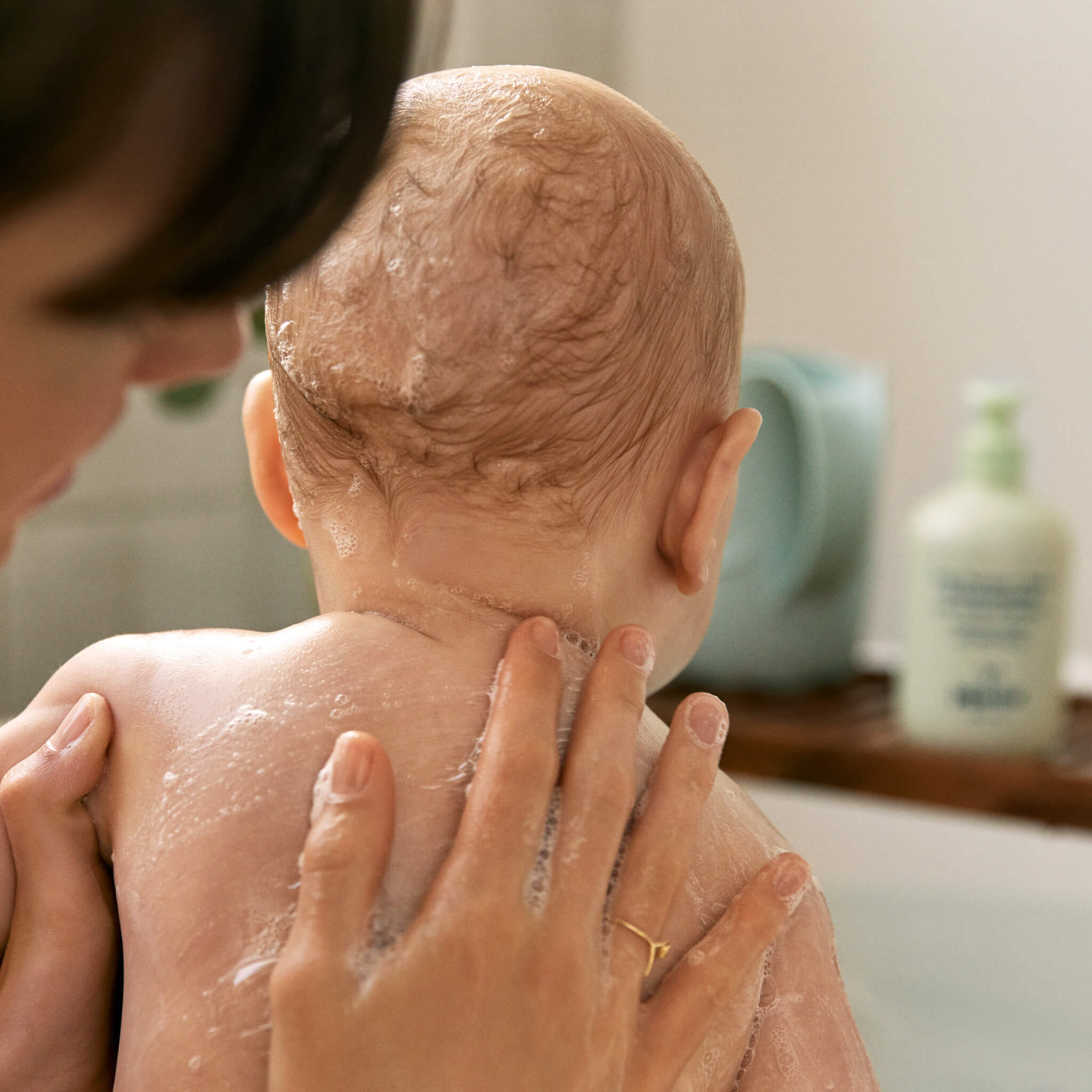 Mom washing baby