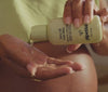 Mom pouring Baby Oil