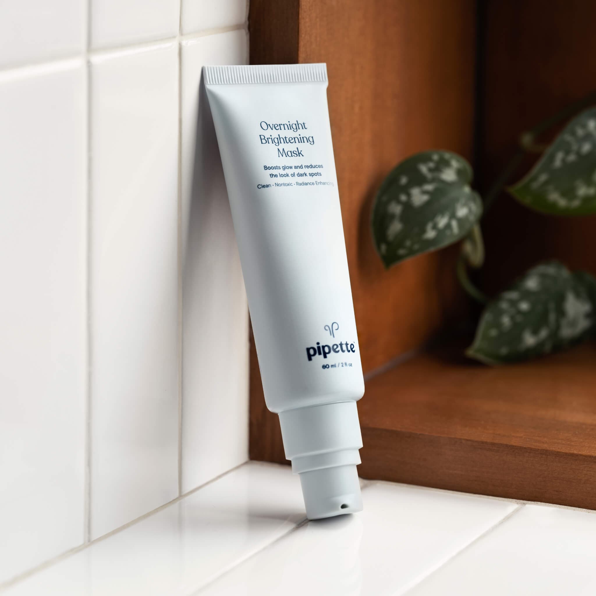 non-toxic overnight brightening mask for radiance enhancement for the face placed in a bathroom